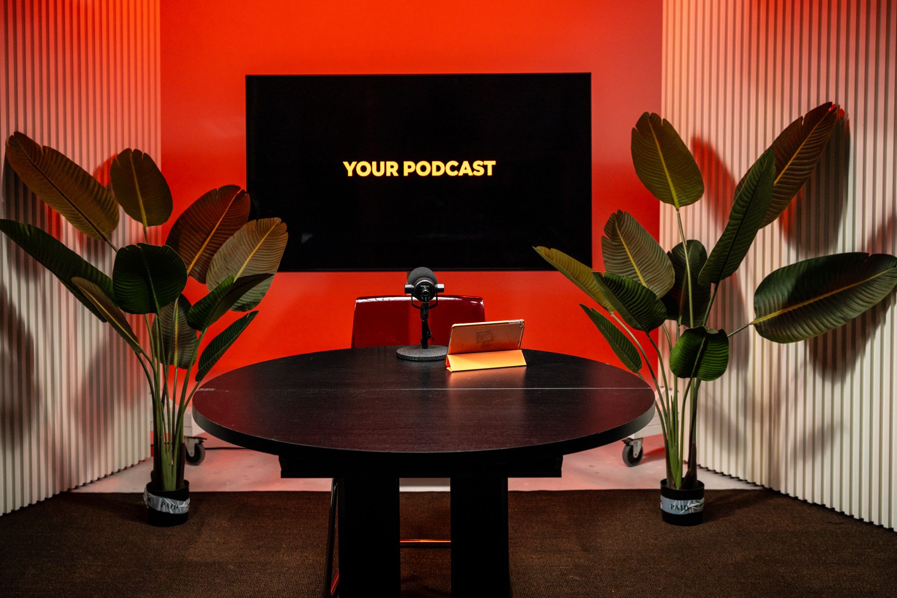 Solo podcast and video sales letter (VSL) recording set with red backdrop in Miami