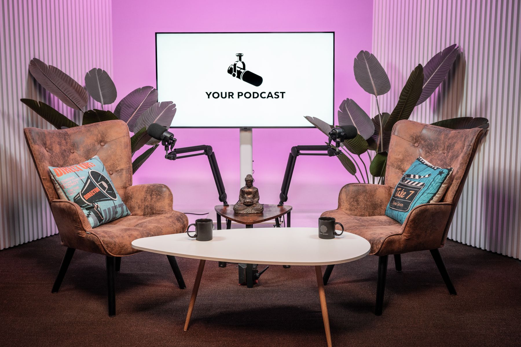 Interview podcast set with pink lighting, tropical plants and branded screen, Miami